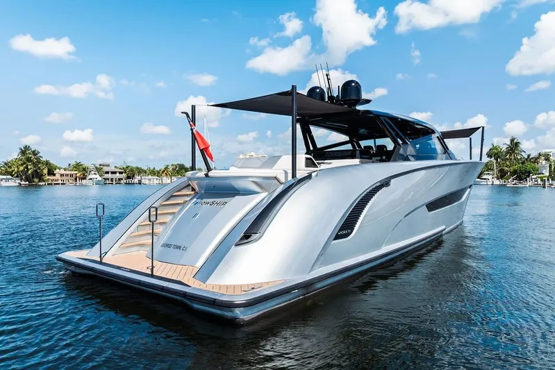 Fellowship II Yacht Photos Pics Luxury 2023 Wajer 77 yacht on serene water, showcasing sleek design and elegance.