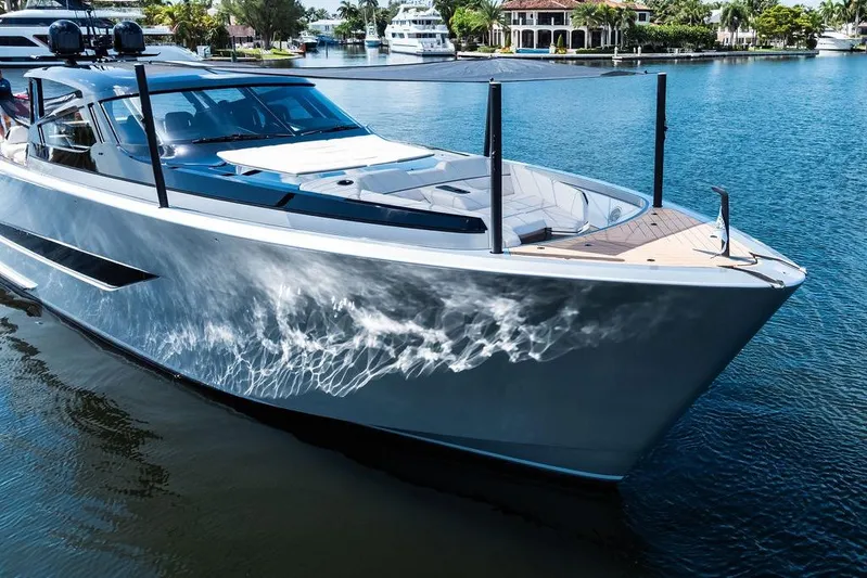 Fellowship II Yacht Photos Pics Luxury 2023 Wajer 77 yacht on serene water, showcasing sleek design and elegance.