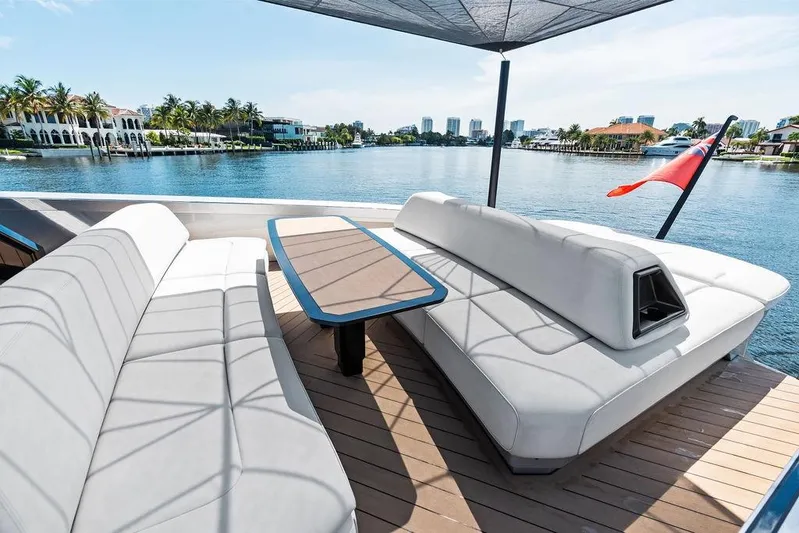 Fellowship II Yacht Photos Pics Luxurious 2023 Wajer 77 yacht deck with elegant seating and scenic waterfront view.