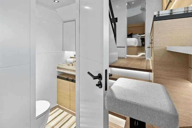 Fellowship II Yacht Photos Pics Luxurious interior of 2023 Wajer 77 yacht featuring modern bathroom and cozy bedroom.