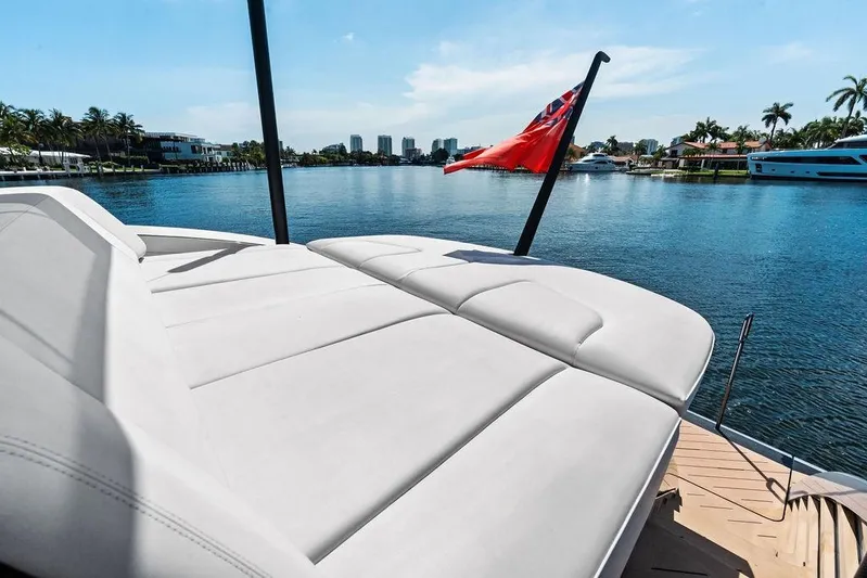 Fellowship II Yacht Photos Pics Luxurious 2023 Wajer 77 yacht with sunbed, cruising on a scenic waterway.