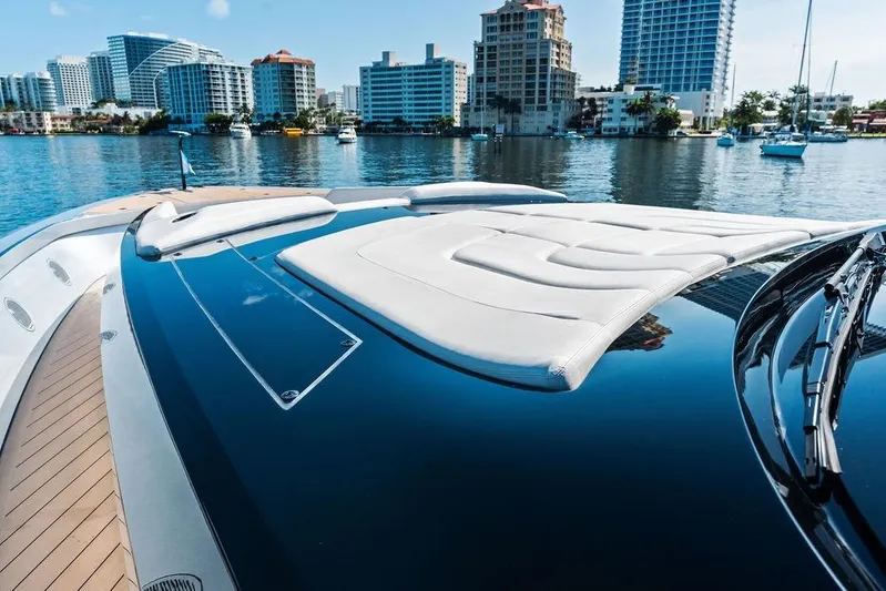 Fellowship II Yacht Photos Pics Luxurious 2023 Wajer 77 yacht with sleek design, docked near modern city skyline.