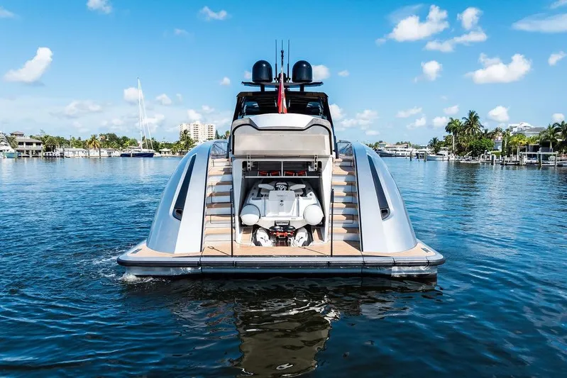 Fellowship II Yacht Photos Pics 2023 Wajer 77 yacht with open garage, docked on a sunny day.