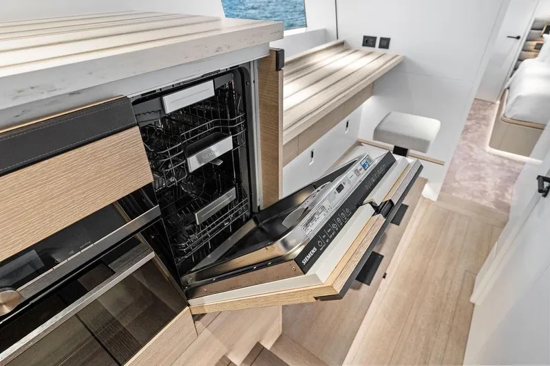 Fellowship II Yacht Photos Pics Luxurious interior of 2023 Wajer 77 yacht featuring a modern kitchen with Siemens appliances.