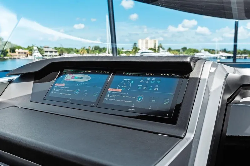 Fellowship II Yacht Photos Pics Dashboard of 2023 Wajer 77 yacht with dual touchscreen displays, marina view.
