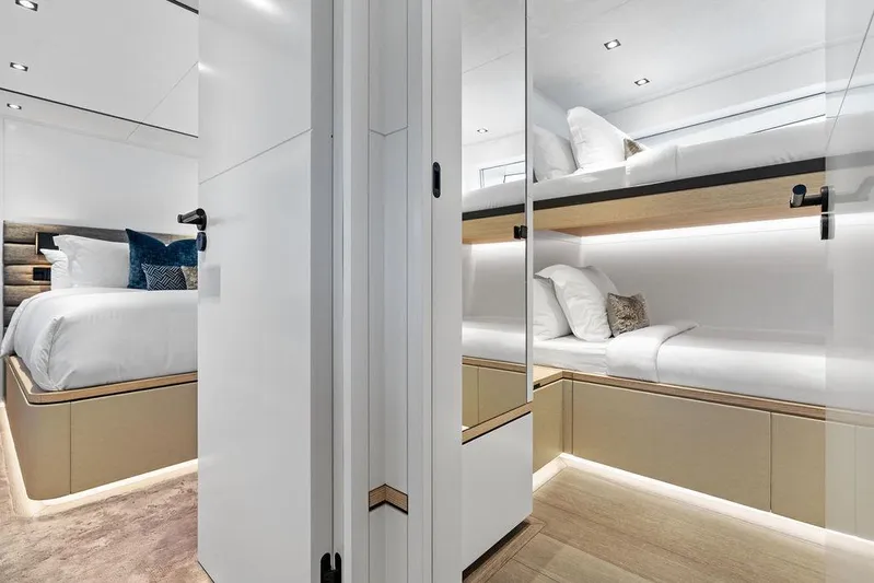 Fellowship II Yacht Photos Pics Luxurious interior of 2023 Wajer 77 yacht featuring elegant bedding and modern design.