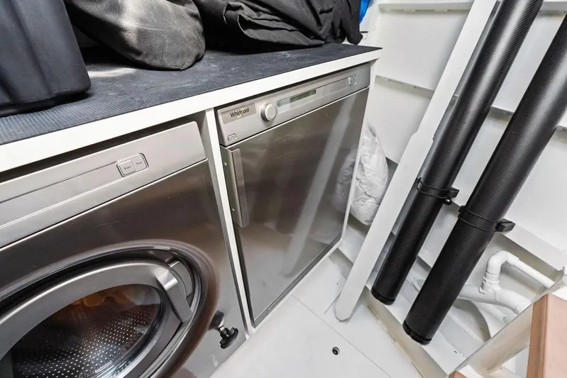 Fellowship II Yacht Photos Pics Laundry area on a 2023 Wajer 77 yacht with Whirlpool appliances.