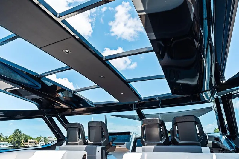 Fellowship II Yacht Photos Pics Interior view of 2023 Wajer 77 yacht with sleek glass roof and modern seating.