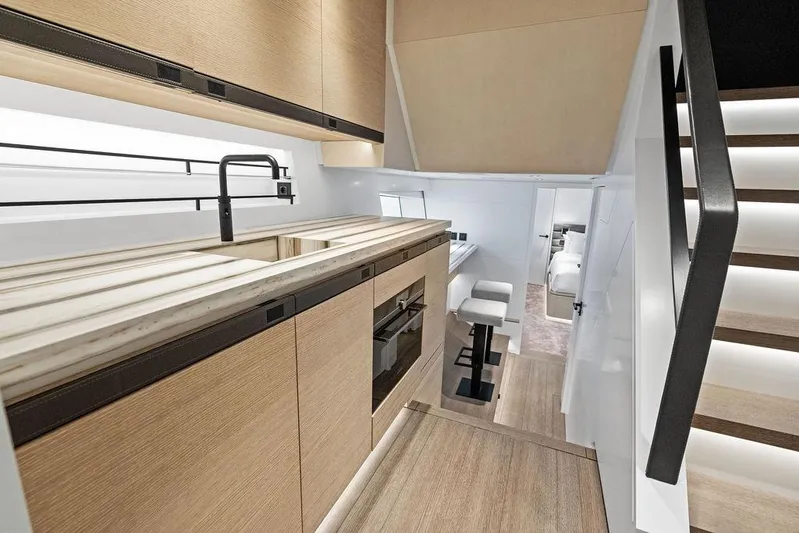 Fellowship II Yacht Photos Pics Luxurious interior of 2023 Wajer 77 yacht featuring modern kitchen and elegant design.