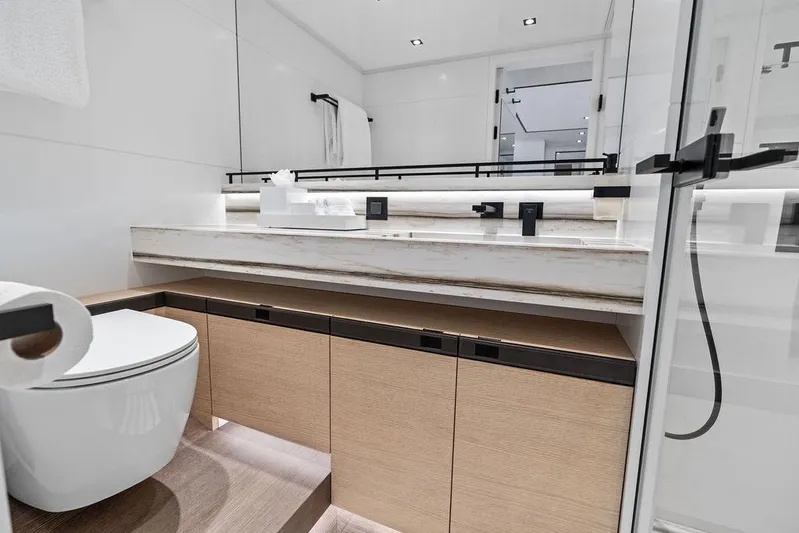 Fellowship II Yacht Photos Pics Luxurious bathroom interior of 2023 Wajer 77 yacht with modern fixtures and sleek design.