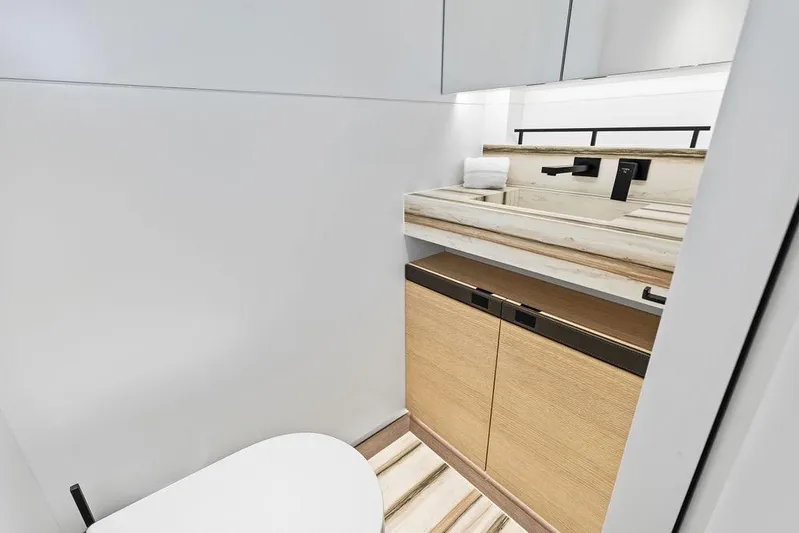 Fellowship II Yacht Photos Pics Luxurious bathroom interior of 2023 Wajer 77 yacht with modern fixtures and wooden cabinetry.