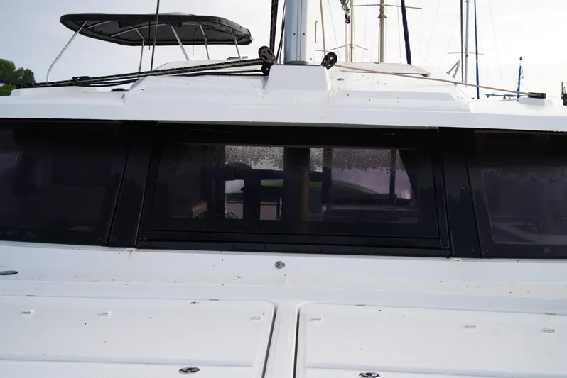Elysium 1 Yacht Photos Pics 2022 Fountaine Pajot Elba Quatour catamaran, front view with sleek design and modern windows.