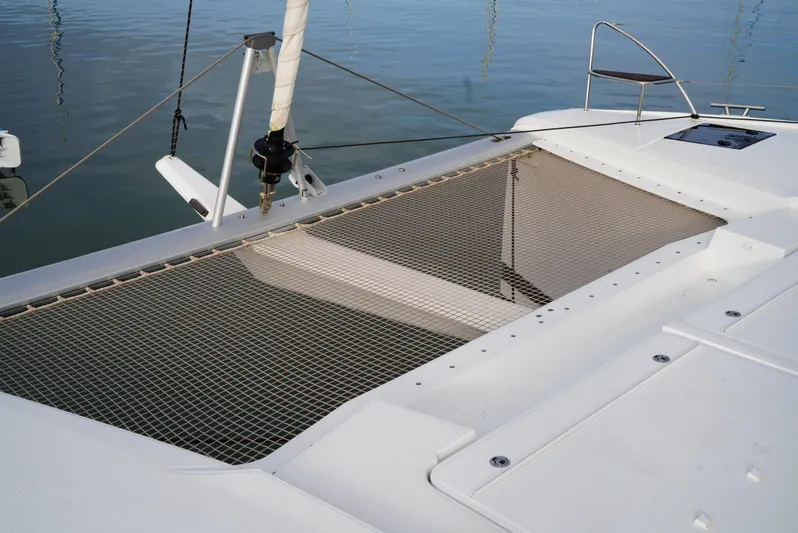 Elysium 1 Yacht Photos Pics Fountaine Pajot Elba Quatour 2022 catamaran netting over calm water.