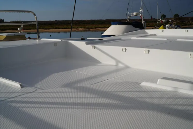 Elysium 1 Yacht Photos Pics 2022 Fountaine Pajot Elba Quatour catamaran deck, featuring spacious white seating area.