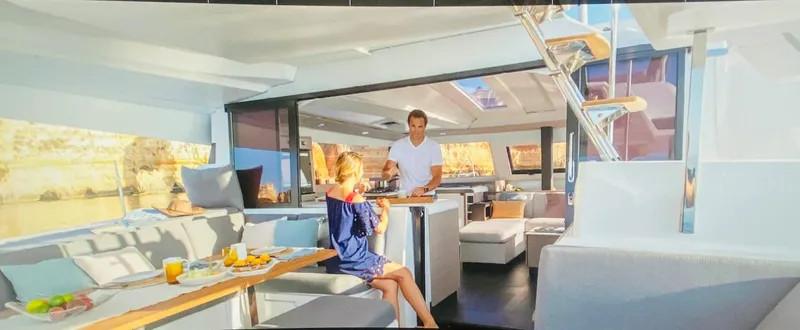 Elysium 1 Yacht Photos Pics Interior of 2022 Fountaine Pajot Elba Quatour catamaran with dining area and modern design.