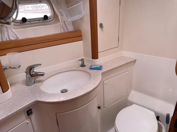Dream Again II Yacht Photos Pics Luxurious bathroom in 2003 Oyster 53 yacht with modern fixtures and elegant design.