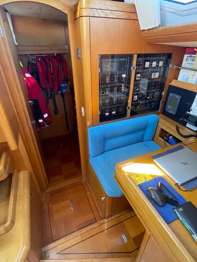 Dream Again II Yacht Photos Pics Interior of 2003 Oyster 53 yacht with navigation station and storage area.