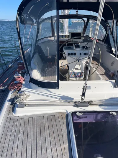 Dream Again II Yacht Photos Pics 2003 Oyster 53 yacht cockpit with steering wheel and navigation equipment on open water.