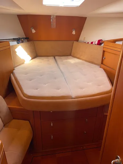 Dream Again II Yacht Photos Pics Luxurious cabin interior of 2003 Oyster 53 yacht with comfortable bedding.
