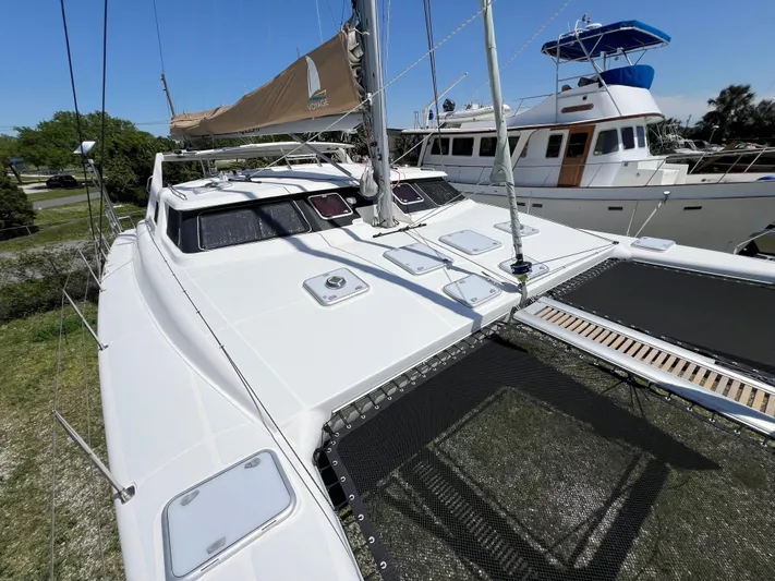 Gods Grace Yacht Photos Pics Sleek 2010 Voyage Yachts 500 catamaran docked, showcasing modern design and spacious deck.