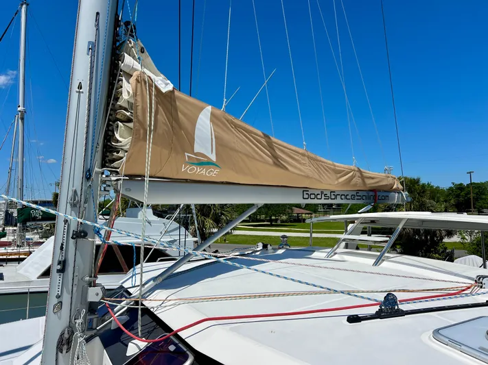 Gods Grace Yacht Photos Pics Sailboat Voyage Yachts 500, 2010 model, docked with tan sail cover under clear blue sky.