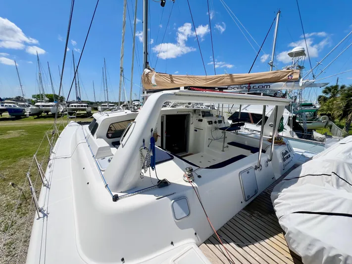 Gods Grace Yacht Photos Pics Voyage Yachts 500, 2010 model, docked with clear skies and surrounding boats.