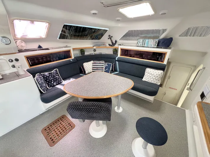 Gods Grace Yacht Photos Pics Interior of 2010 Voyage Yachts 500, featuring a cozy seating area with nautical decor.