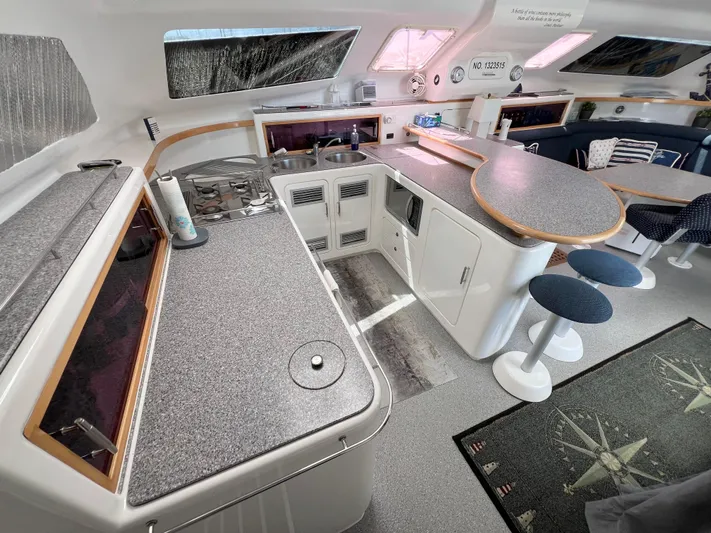 Gods Grace Yacht Photos Pics Spacious kitchen area in a 2010 Voyage Yachts 500, featuring modern countertops and seating.