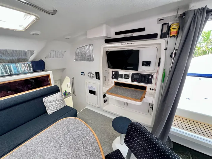 Gods Grace Yacht Photos Pics Interior of 2010 Voyage Yachts 500, featuring modern seating and entertainment system.