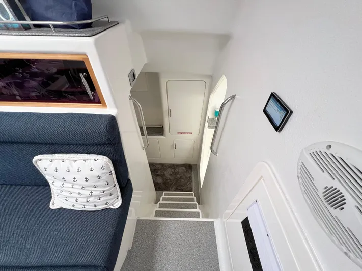 Gods Grace Yacht Photos Pics Interior of 2010 Voyage Yachts 500, featuring stairs, seating, and nautical-themed decor.