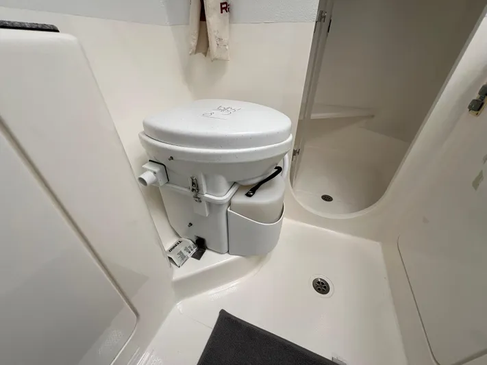 Gods Grace Yacht Photos Pics Compact bathroom with toilet in 2010 Voyage Yachts 500 model.