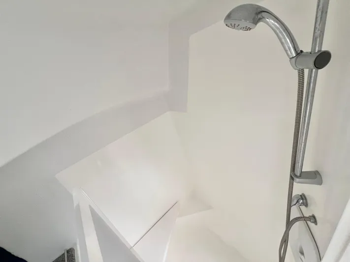 Gods Grace Yacht Photos Pics Shower area in 2010 Voyage Yachts 500, featuring sleek white design and modern fixtures.