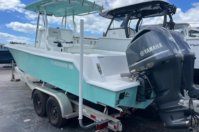  Yacht Photos Pics 2013 Contender 28 Sport boat with Yamaha engines on a trailer.