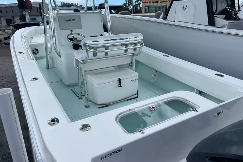  Yacht Photos Pics 2013 Contender 28 Sport boat interior with seating and control panel.