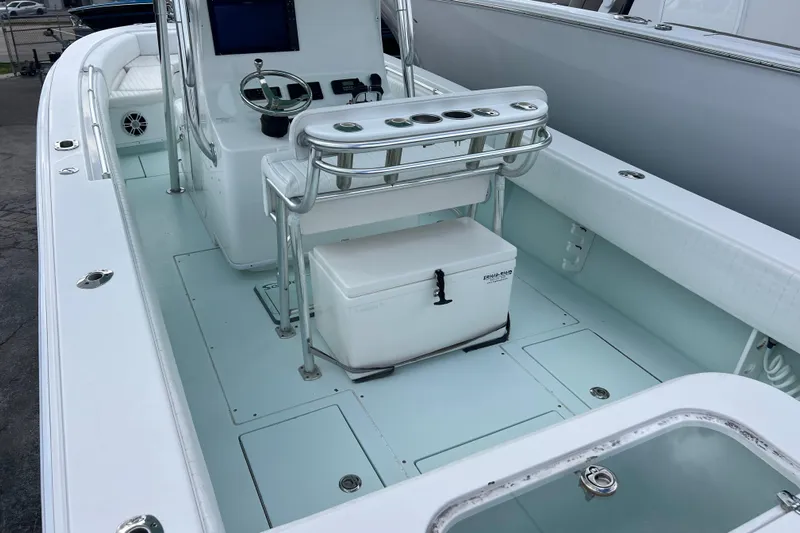  Yacht Photos Pics 2013 Contender 28 Sport boat interior with steering console and seating.