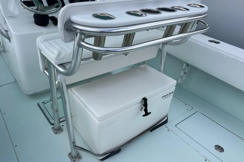  Yacht Photos Pics 2013 Contender 28 Sport boat interior with seating and storage cooler.