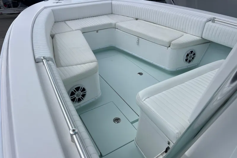  Yacht Photos Pics 2013 Contender 28 Sport boat interior with white cushioned seating and built-in speakers.
