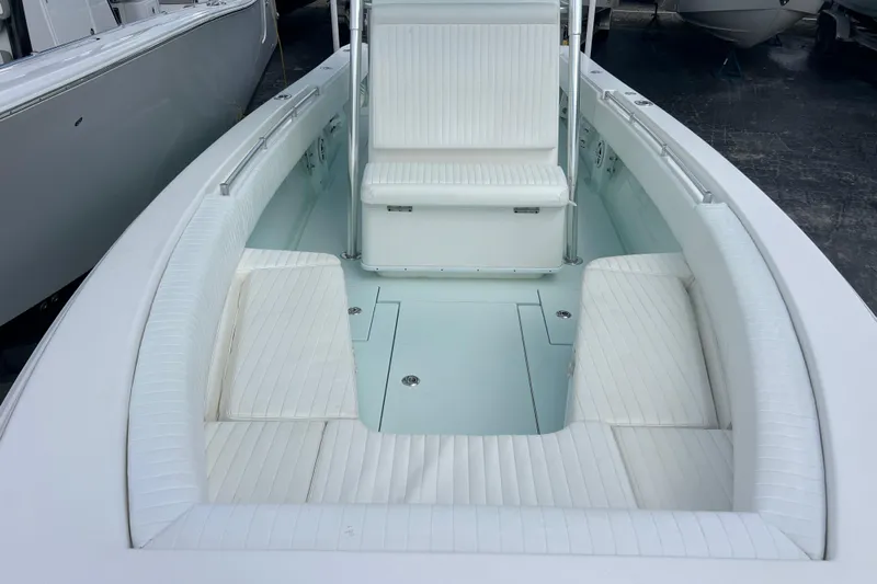  Yacht Photos Pics 2013 Contender 28 Sport boat interior with white seating and spacious deck.