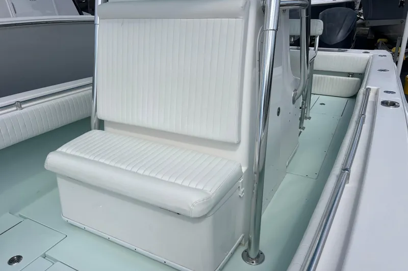  Yacht Photos Pics 2013 Contender 28 Sport boat interior with white seating and stainless steel railings.