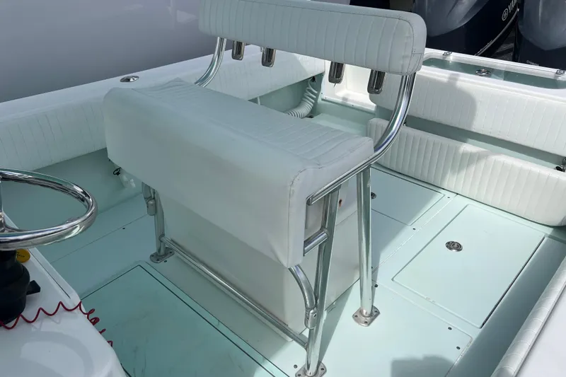  Yacht Photos Pics 2013 Contender 28 Sport boat interior with white seating and steering wheel.