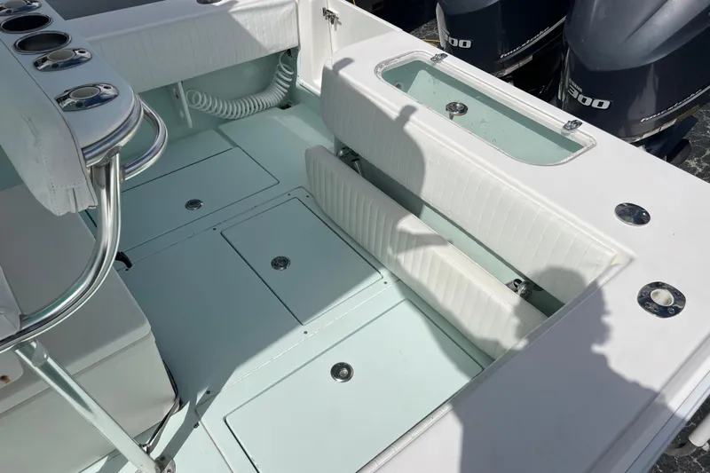  Yacht Photos Pics 2013 Contender 28 Sport boat interior with seating and storage compartments.