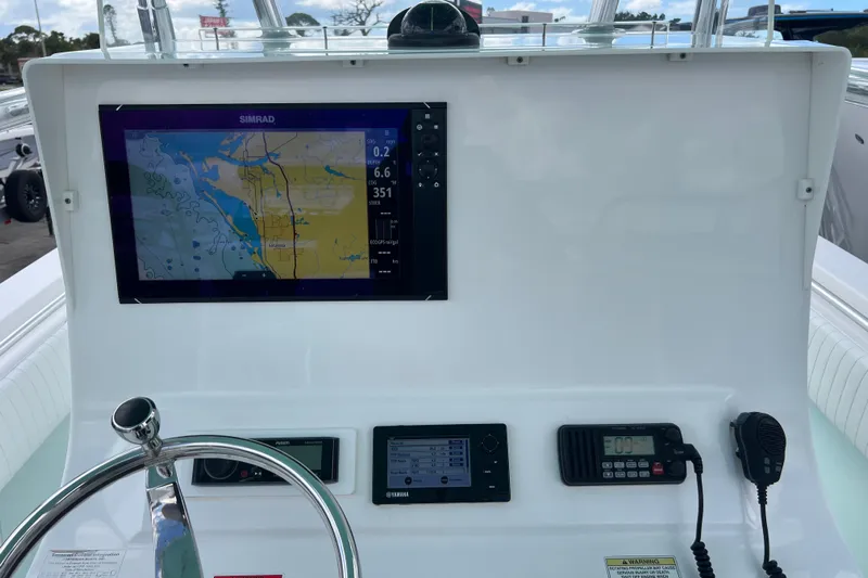  Yacht Photos Pics Dashboard of 2013 Contender 28 Sport boat with navigation and communication equipment.