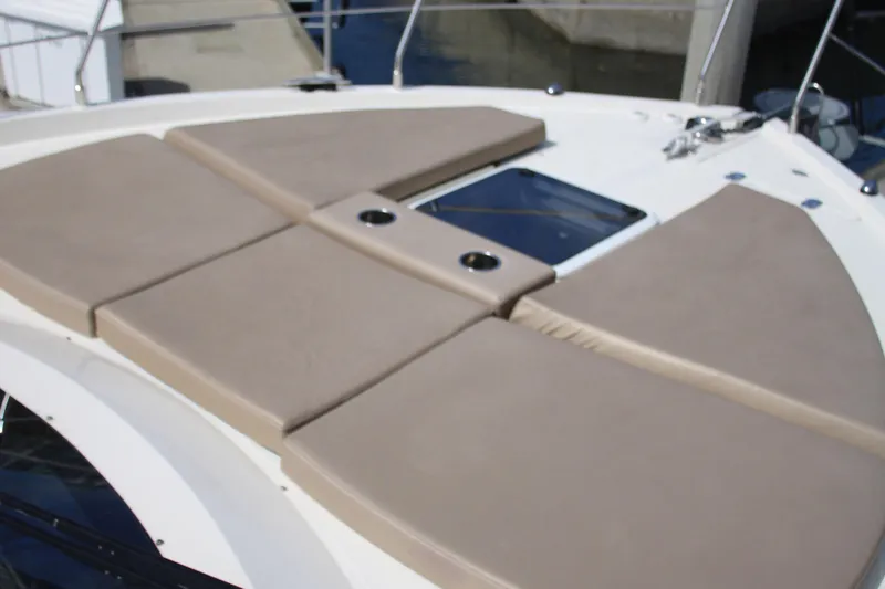 Skywalker Yacht Photos Pics Sunbathing deck on a 2018 Carver C43 Coupe yacht with beige cushions.