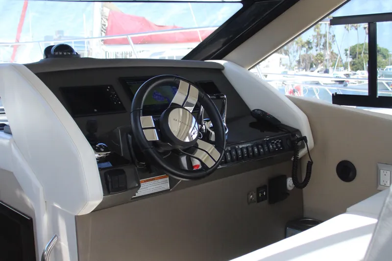 Skywalker Yacht Photos Pics Interior of 2018 Carver C43 Coupe yacht with modern steering and control panel.