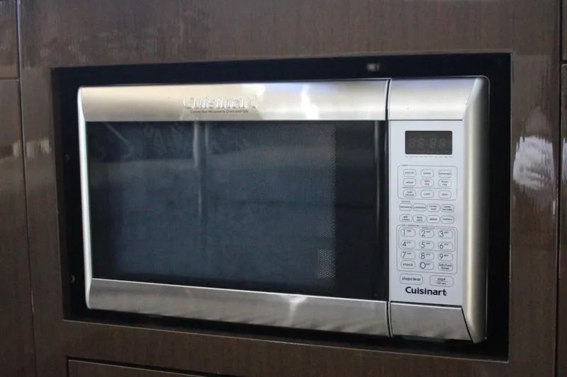 Skywalker Yacht Photos Pics A Cuisinart convection microwave oven with digital controls, set in a dark wood cabinet.