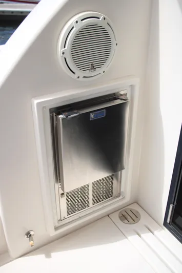 Skywalker Yacht Photos Pics Built-in stainless steel refrigerator on a 2018 Carver C43 Coupe boat.