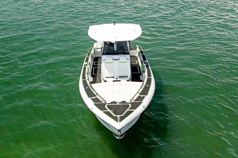 Yacht Photos Pics 2018 Statement 380 Open boat on calm green water, aerial view.