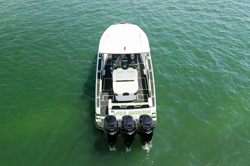  Yacht Photos Pics Aerial view of 2018 Statement 380 Open boat on green water.