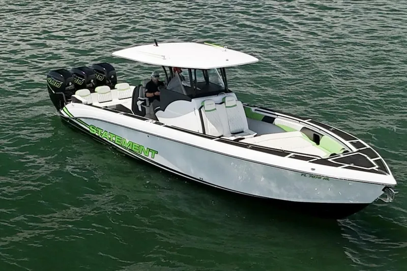  Yacht Photos Pics 2018 Statement 380 Open boat with triple outboard engines on water.