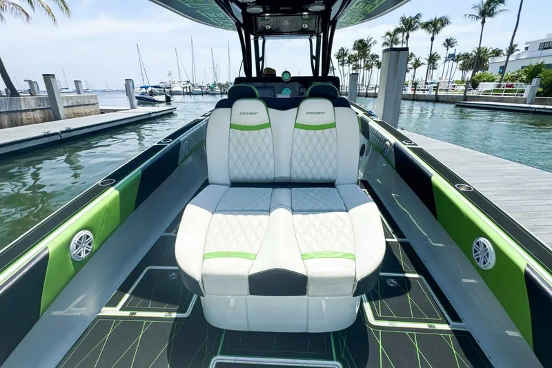  Yacht Photos Pics 2018 Statement 380 Open boat interior with stylish seating at a marina.